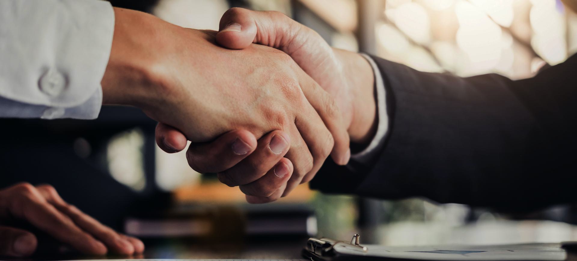 Two people shaking hands.